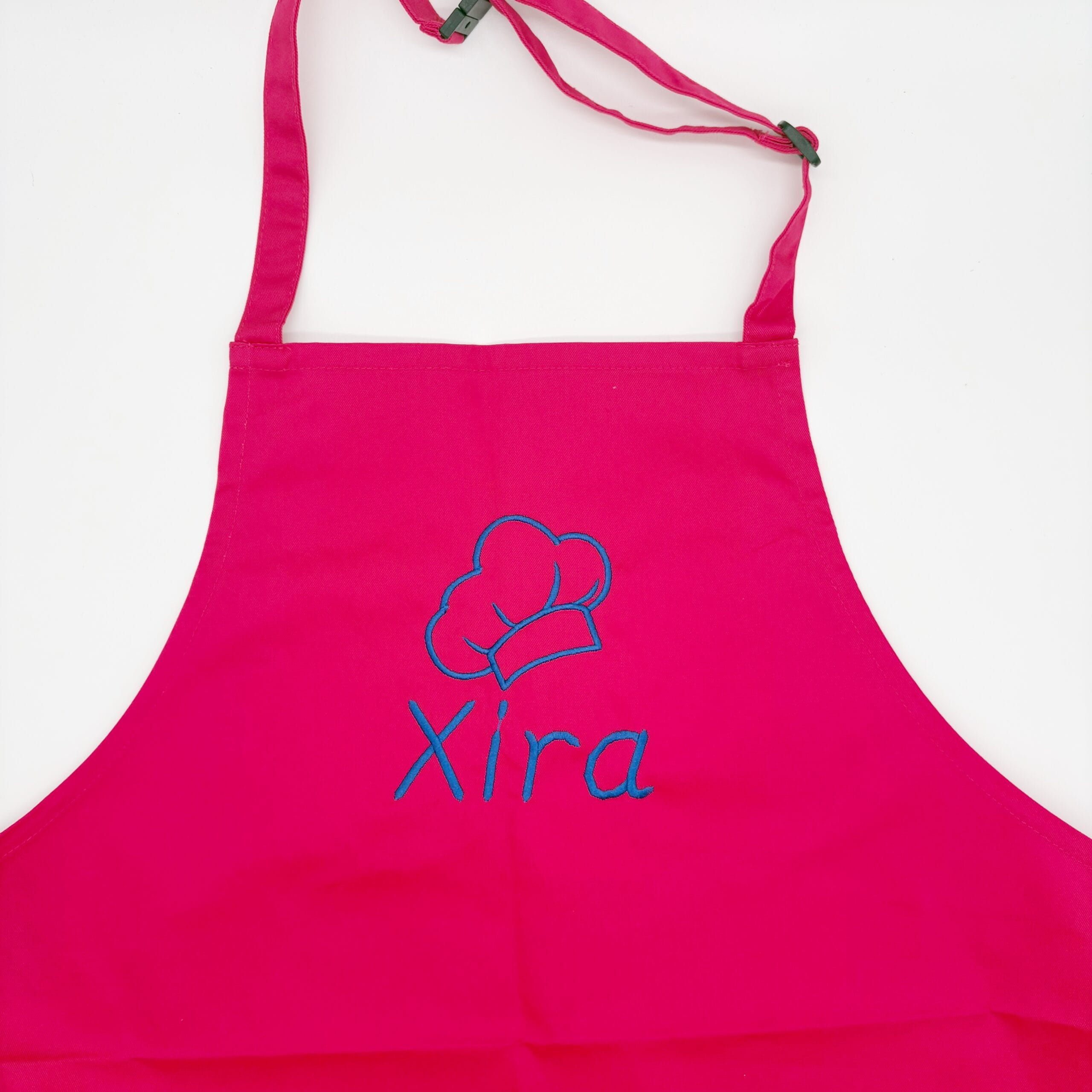 roze Kinderkeukenschort met naam en koksmuts als lijntekening